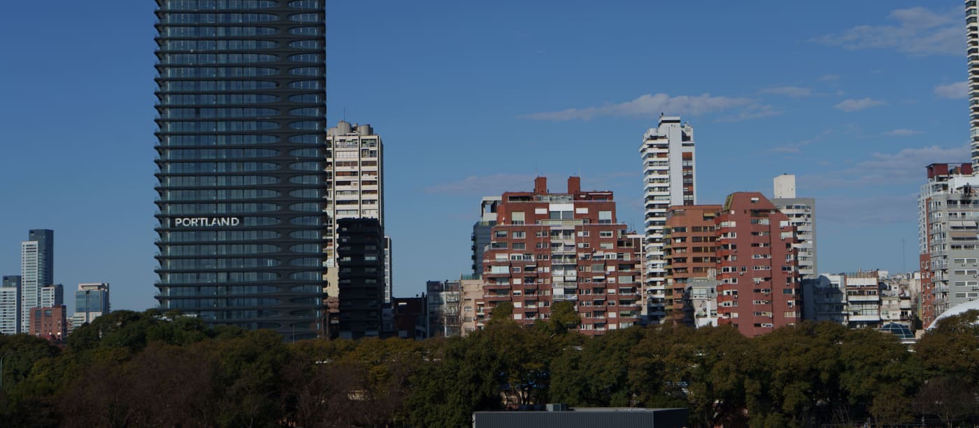 Skyline of modern high-rise apartment towers in Buenos Aires against a clear sky.