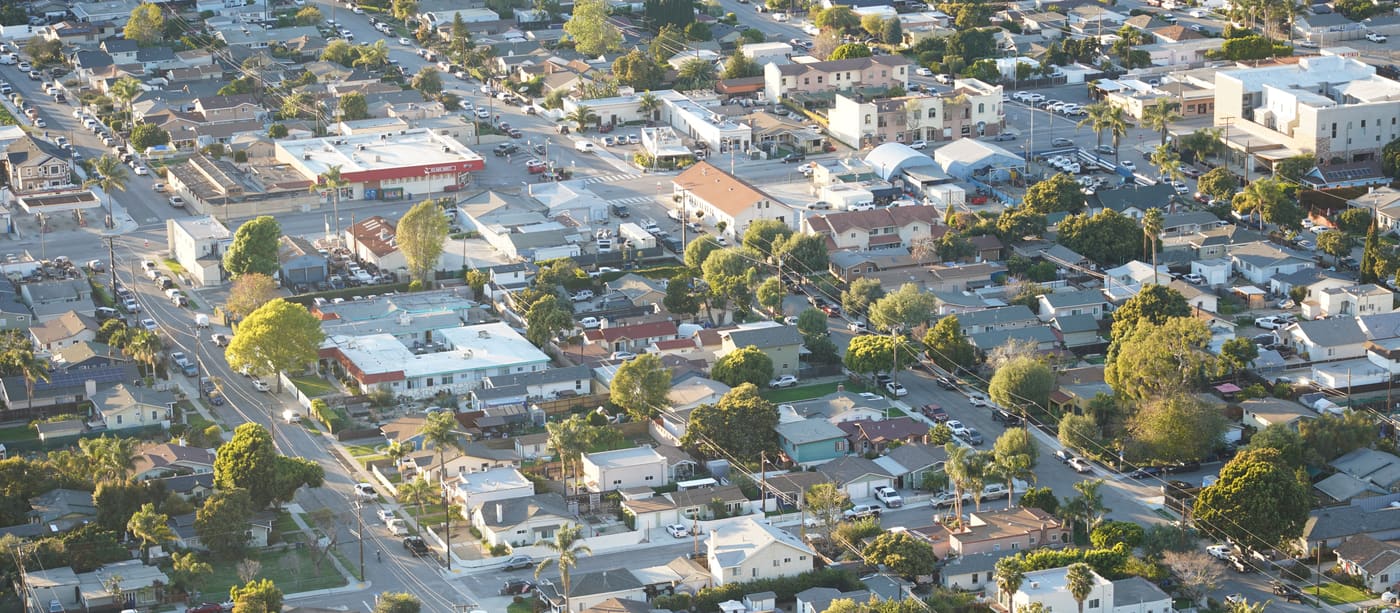 Overhead view of a suburban neighbourhood, showing house plots and the street grid between them.